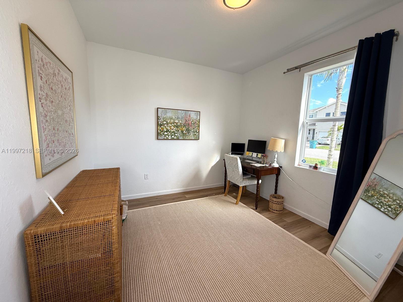 13233 Southwest 272nd Street Homestead, FL 33032 - Photo 17 of 21 a living room with furniture and a window