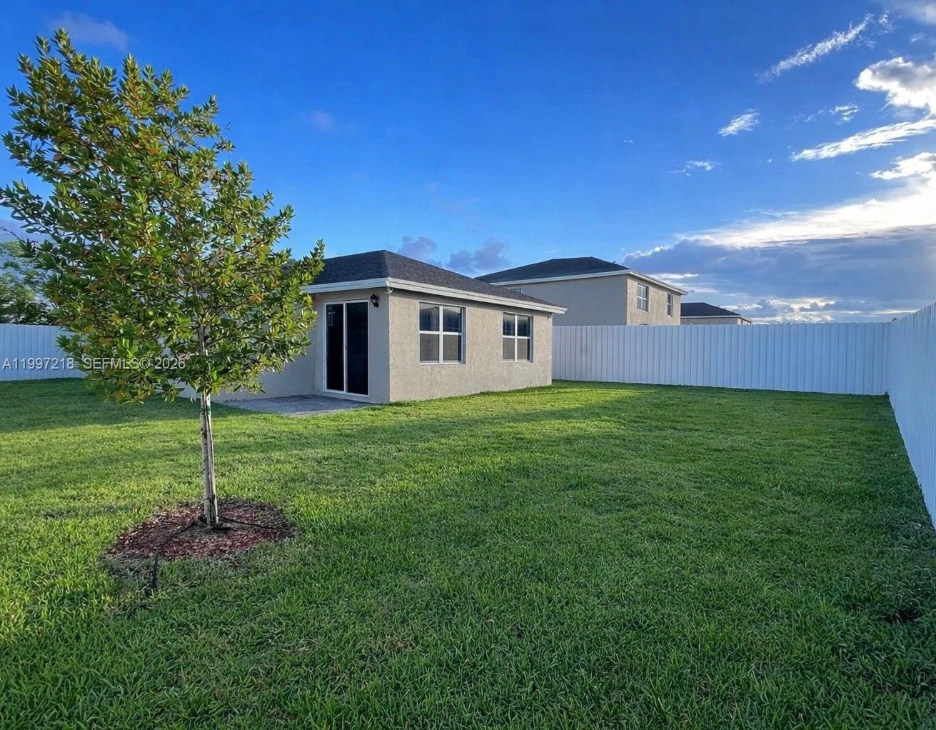 13233 Southwest 272nd Street Homestead, FL 33032 - Photo 20 of 21 a house view with a garden space