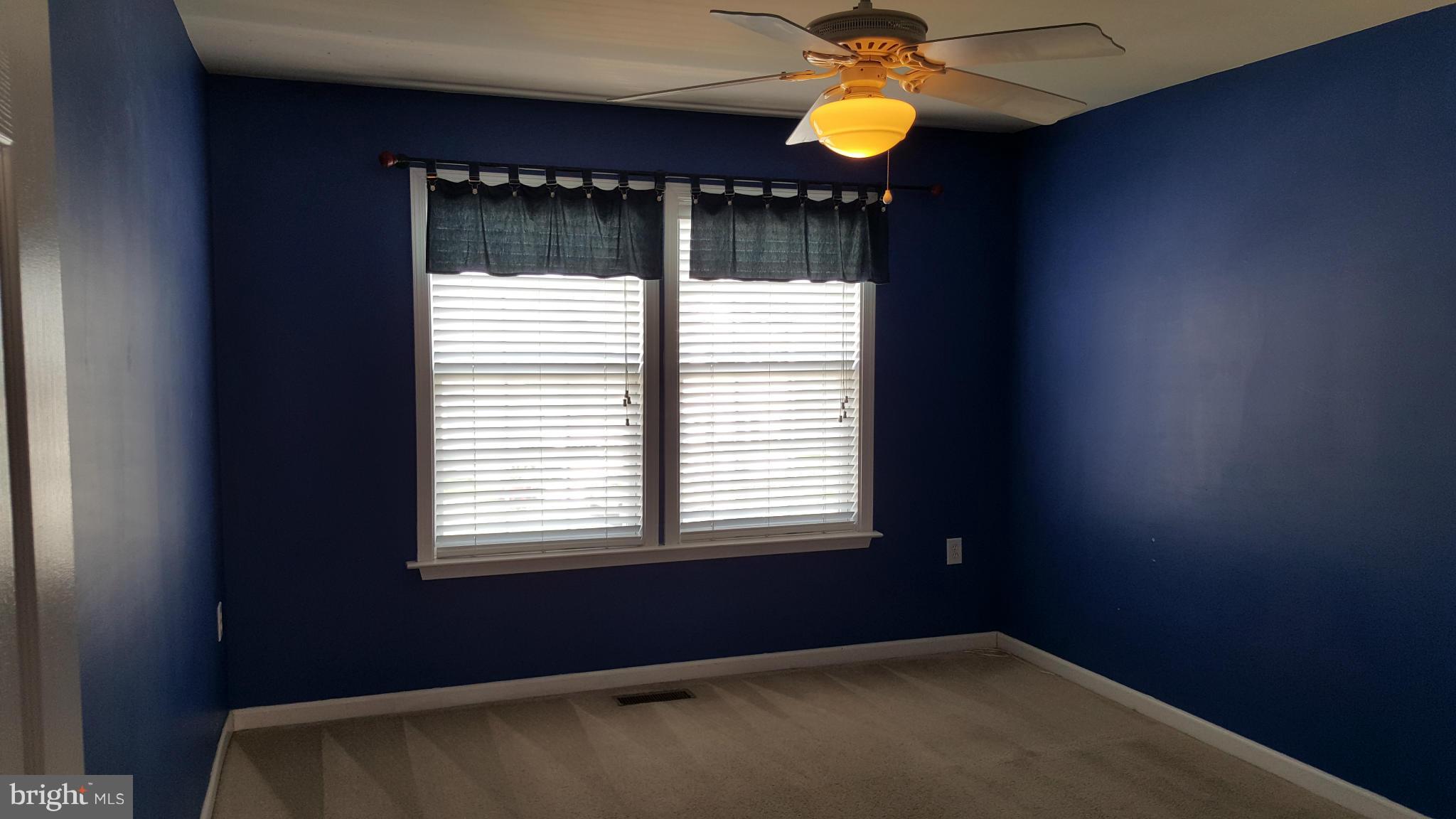 102 Limited Drive Ranson, WV 25438 - Photo 11 of 23 a view of a room that has a window and a fireplace