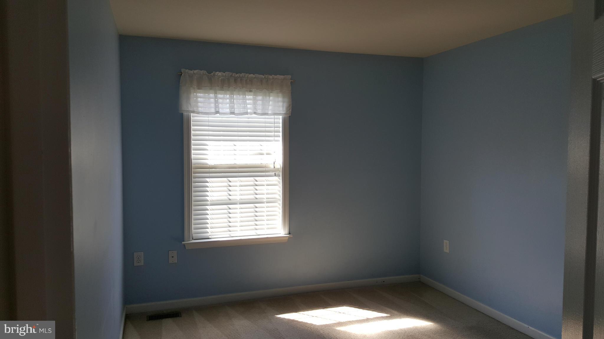 102 Limited Drive Ranson, WV 25438 - Photo 12 of 23 a view of an empty room with a window