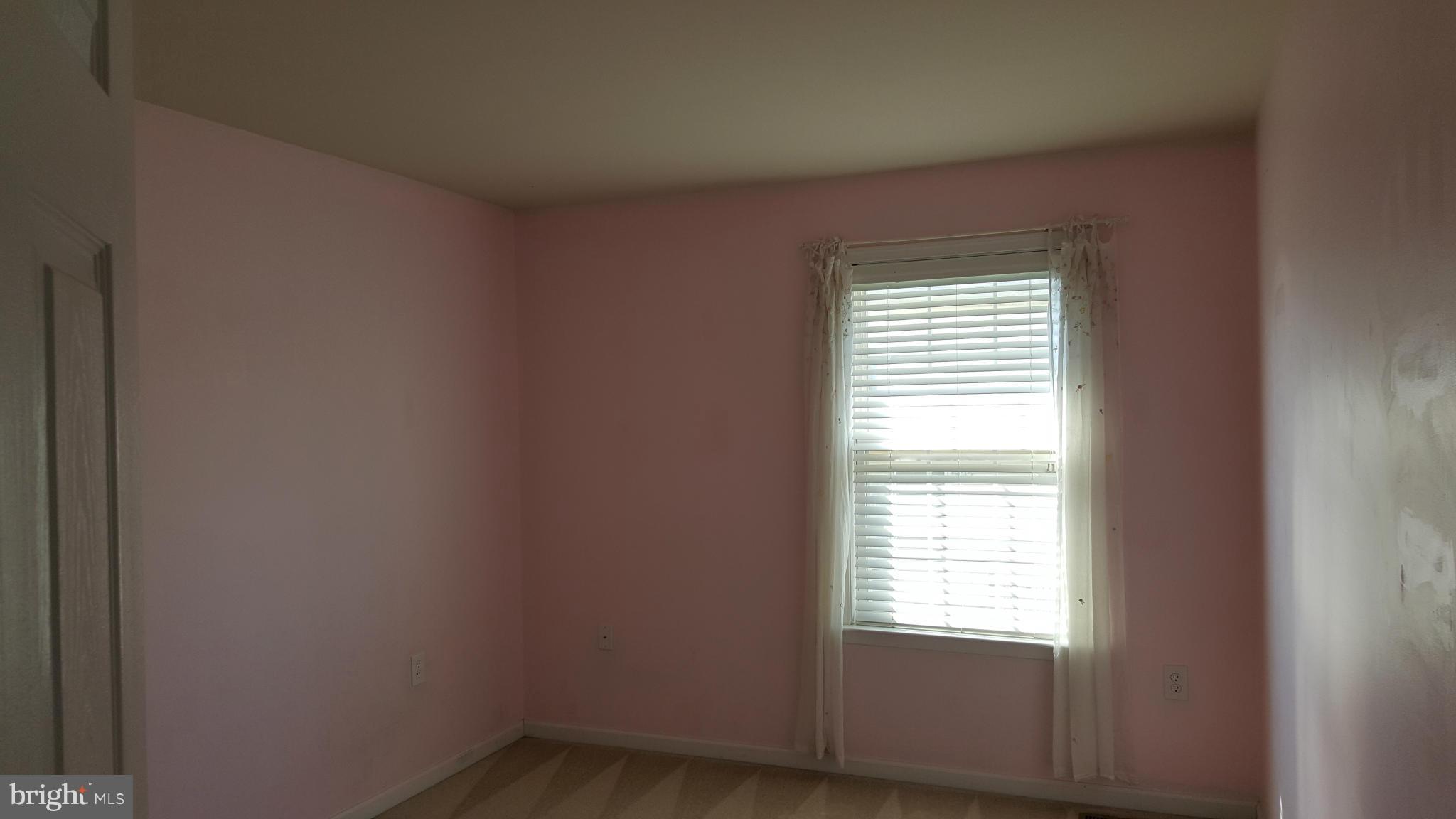 102 Limited Drive Ranson, WV 25438 - Photo 13 of 23 a view of an empty room with a window
