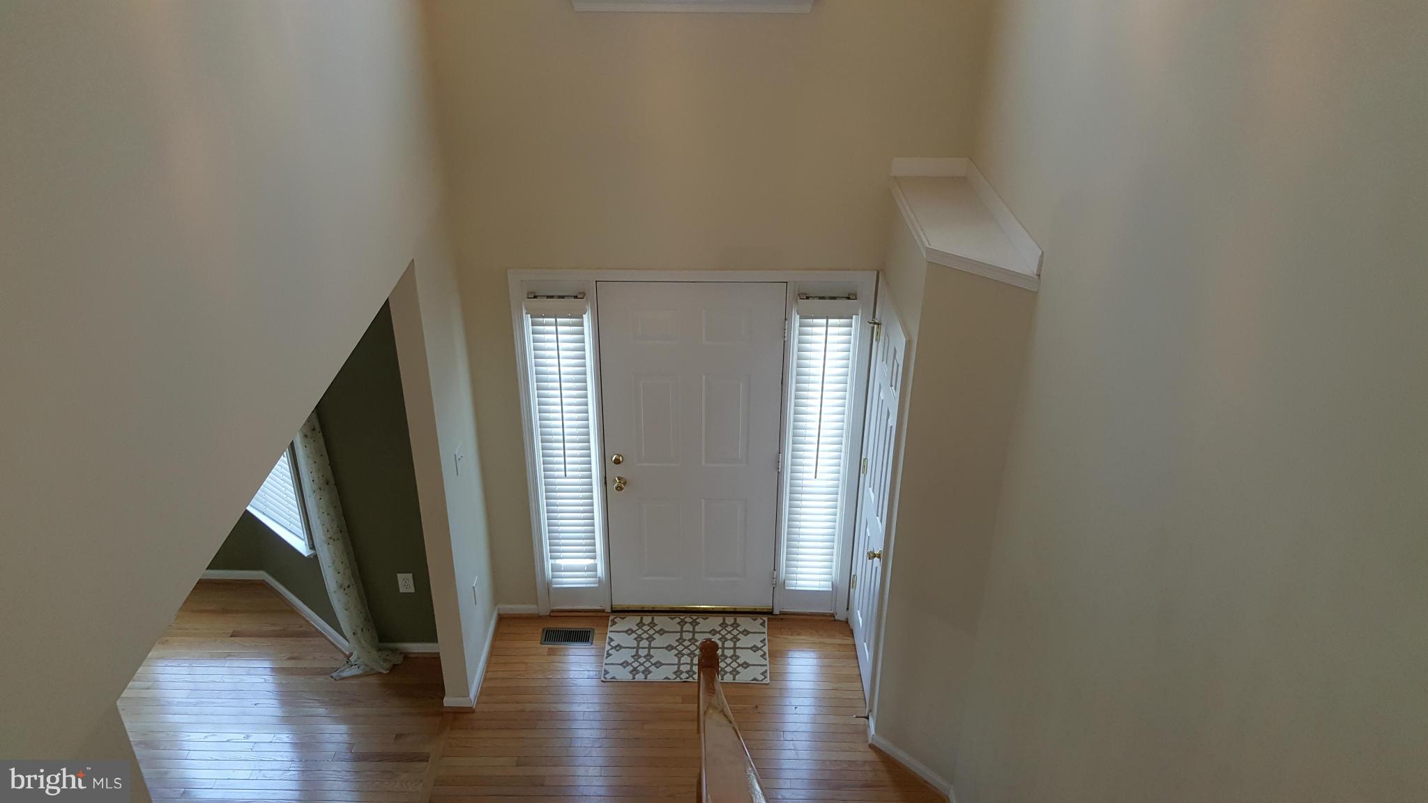 102 Limited Drive Ranson, WV 25438 - Photo 14 of 23 a view of an entryway with wooden floor