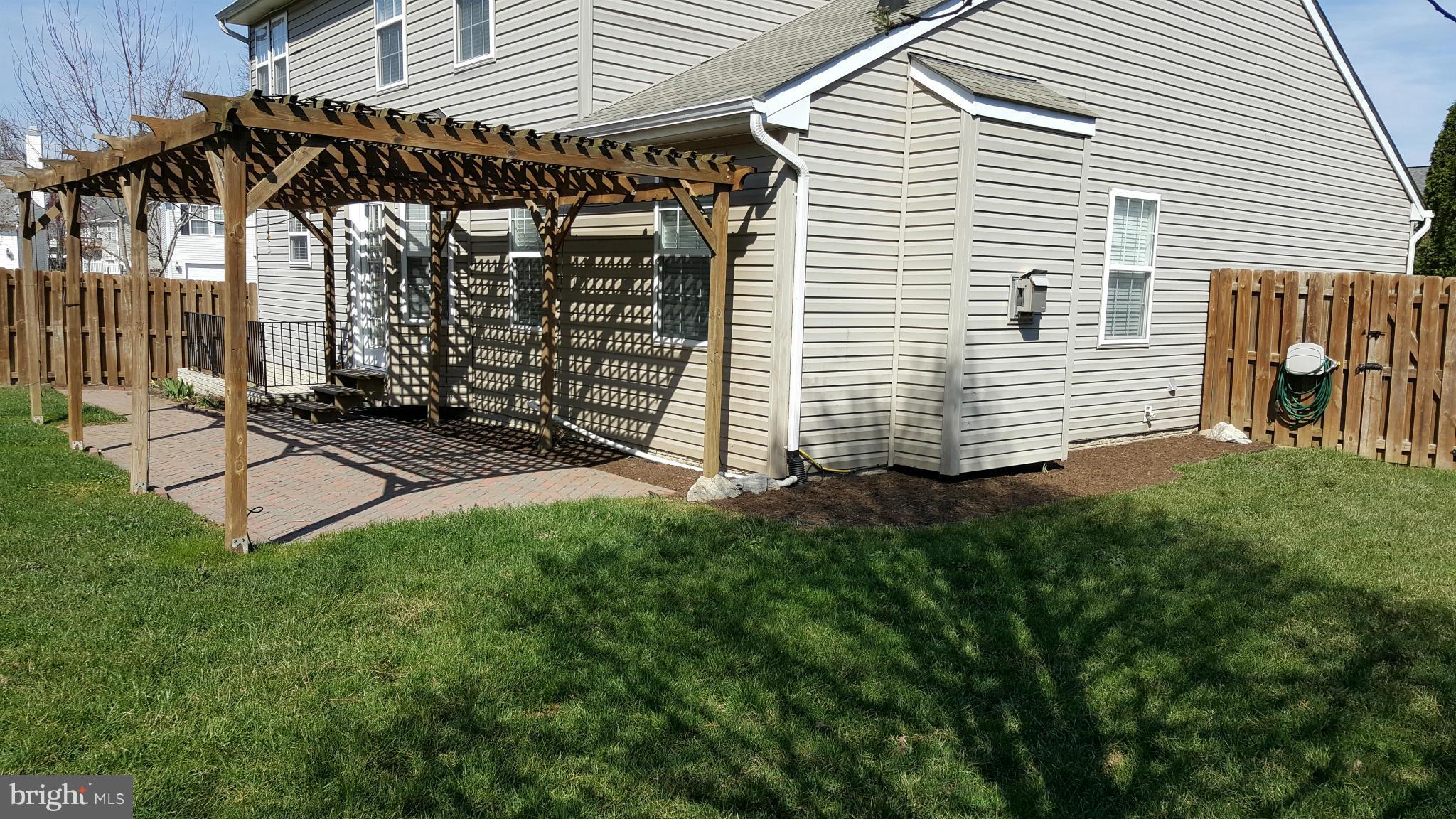 102 Limited Drive Ranson, WV 25438 - Photo 3 of 23 a view of a backyard with sitting area
