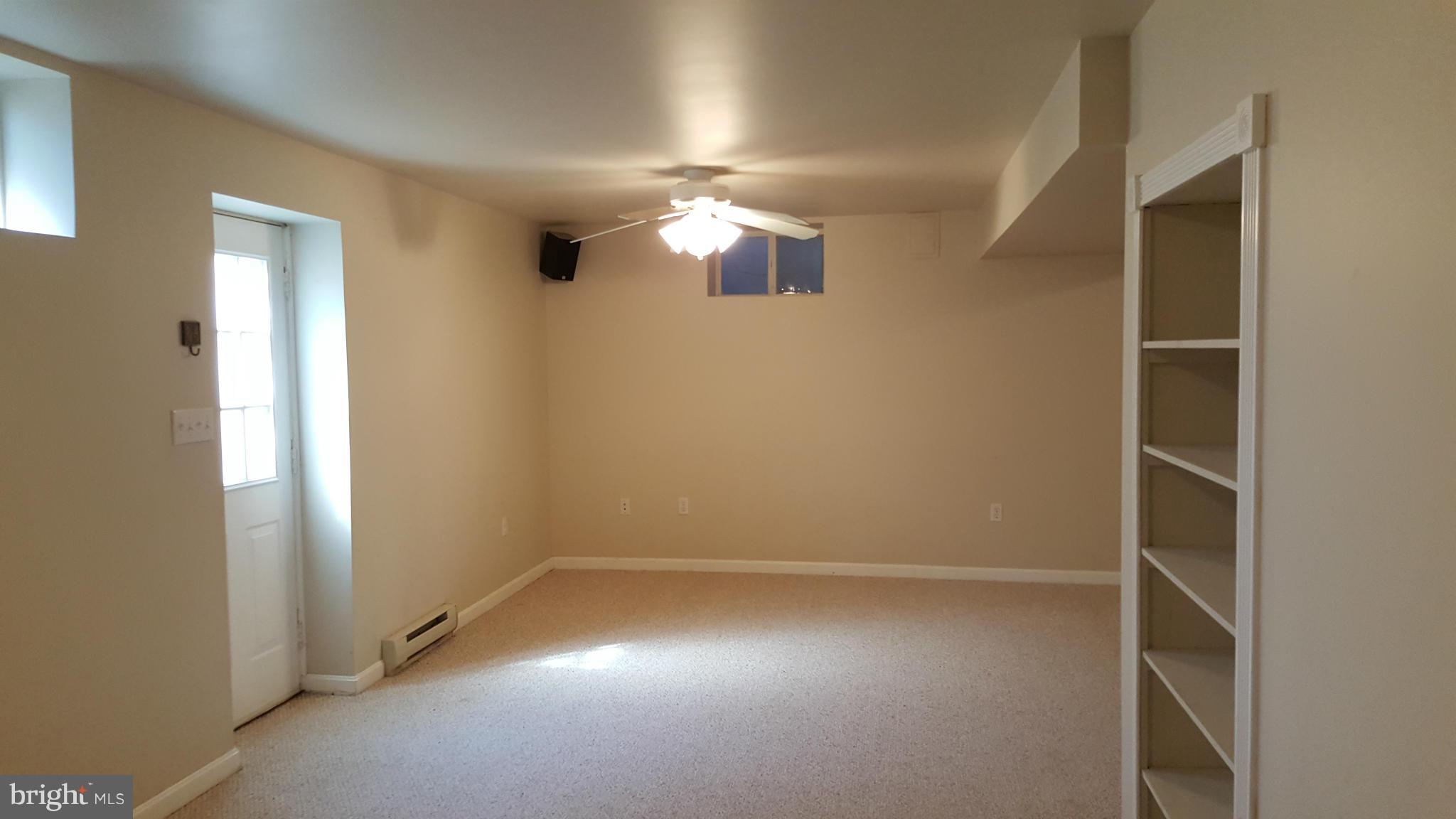 102 Limited Drive Ranson, WV 25438 - Photo 21 of 23 an empty room with windows and entrance