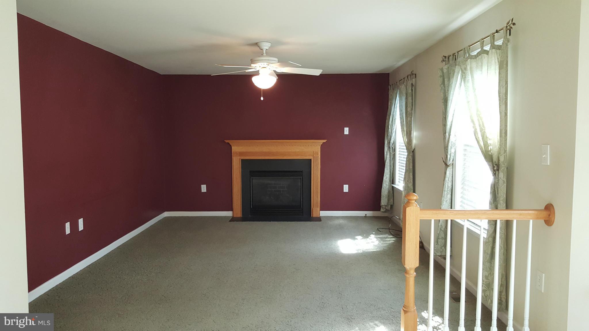 102 Limited Drive Ranson, WV 25438 - Photo 9 of 23 a view of a livingroom with a fireplace