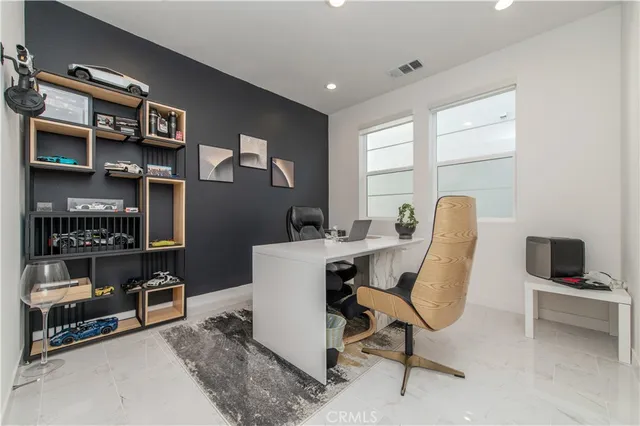 a spacious bedroom with a bed and a window