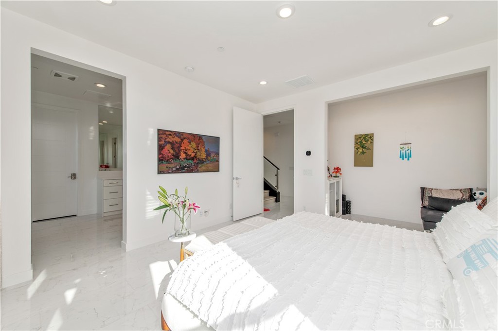 131 Reyes Alley Lake Forest, CA 92630 - Photo 23 of 39 a bedroom with a bed and a flat screen tv