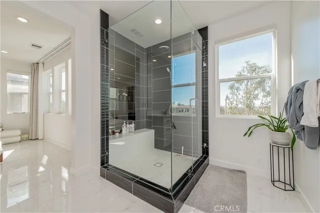 a bathroom with a sink vanity and mirror