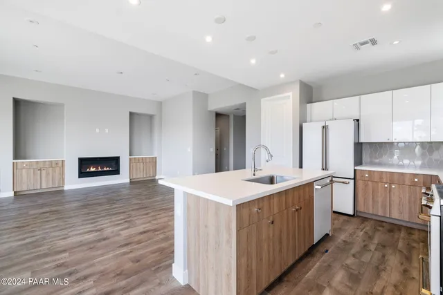 a kitchen with a sink and cabinets