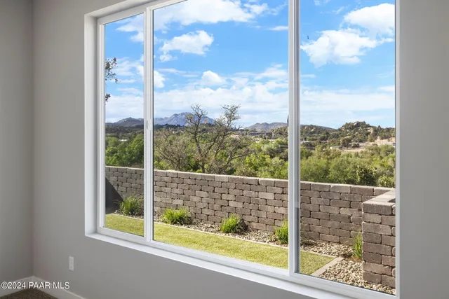 a view of a glass door with a view from a window