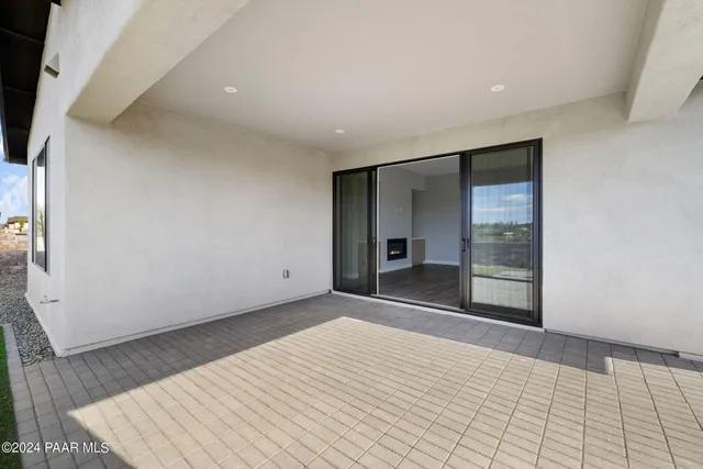 a view of a house with a snow in the background
