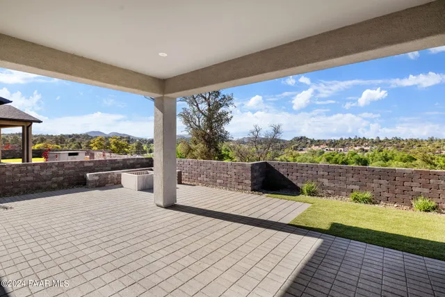 a view of balcony with furniture