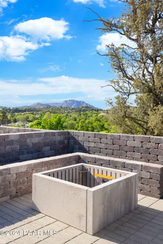 a view of swimming pool with outdoor seating and city view