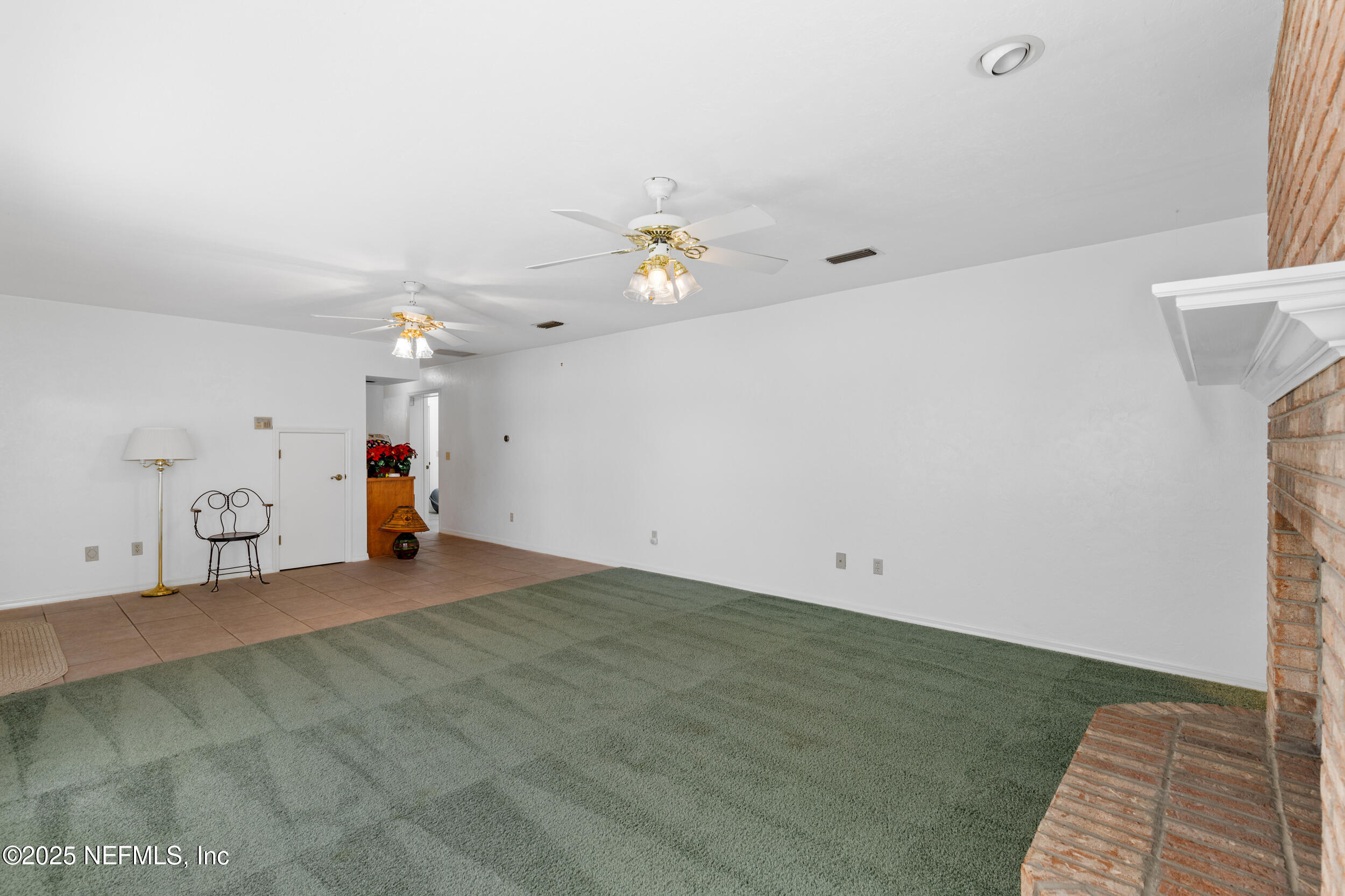 8485 Lilly Lake Road Melrose, FL 32666 - Photo 24 of 44 Downstairs living room