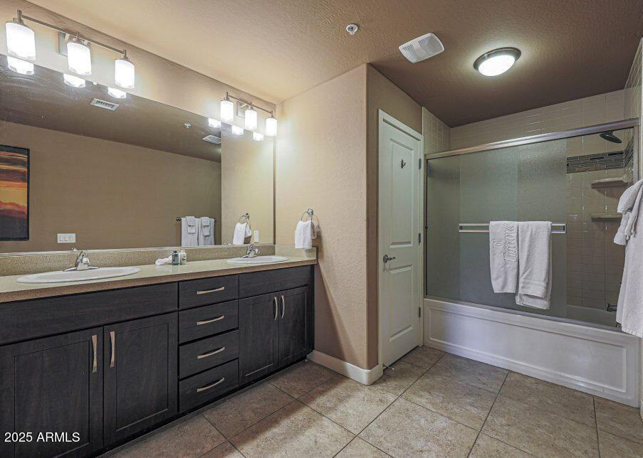 5450 East Deer Valley Drive, Unit 2191 Phoenix, AZ 85054 - Photo 14 of 50 a bathroom with a double vanity sink and a mirror