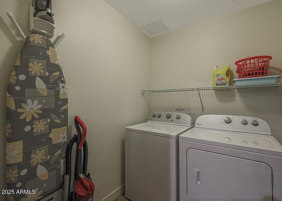 5450 East Deer Valley Drive, Unit 2191 Phoenix, AZ 85054 - Photo 18 of 50 a utility room with dryer and washer