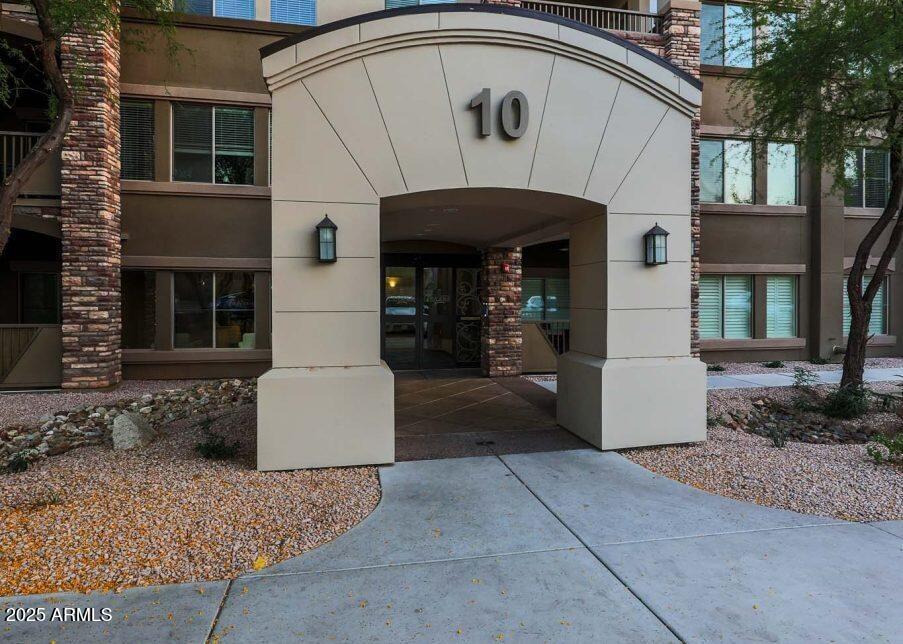 5450 East Deer Valley Drive, Unit 2191 Phoenix, AZ 85054 - Photo 19 of 50 a front view of a house with entryway