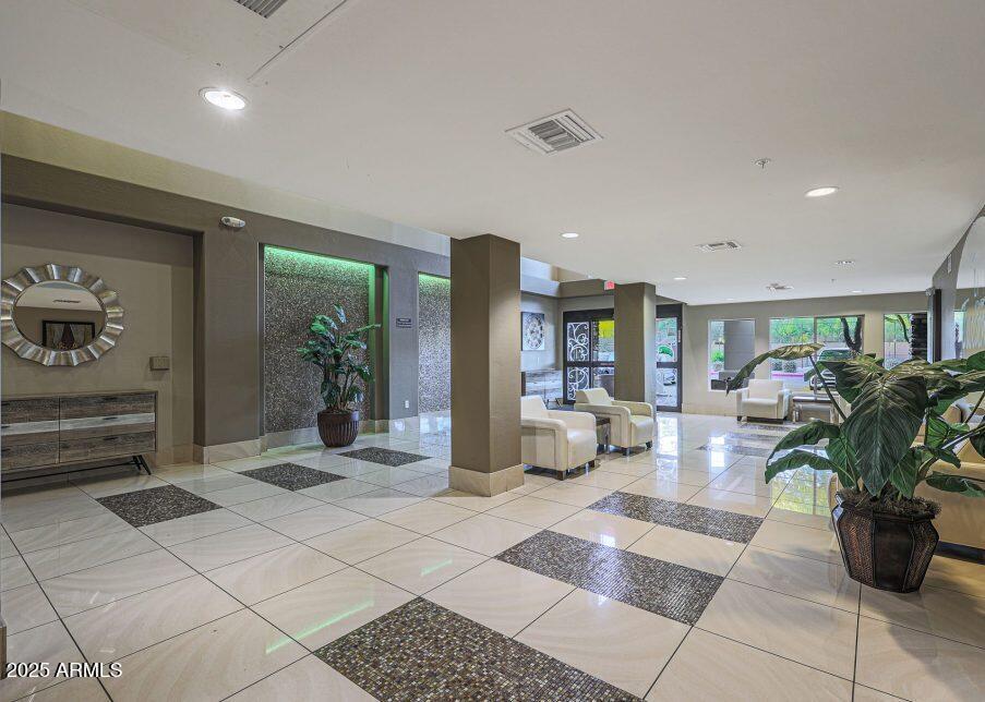 5450 East Deer Valley Drive, Unit 2191 Phoenix, AZ 85054 - Photo 22 of 50 a living room with furniture and potted plant