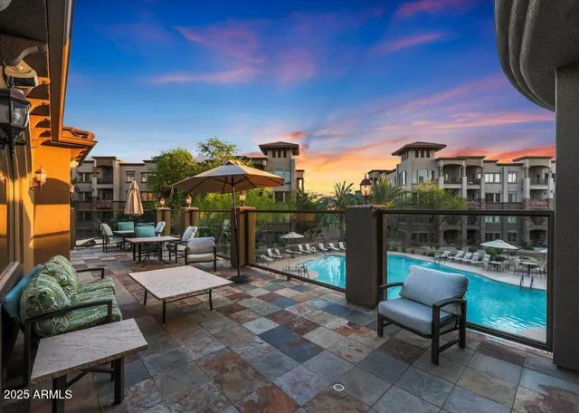 a view of a chairs and table in a patio