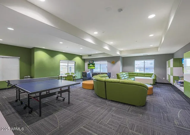 a room with furniture and a pool table
