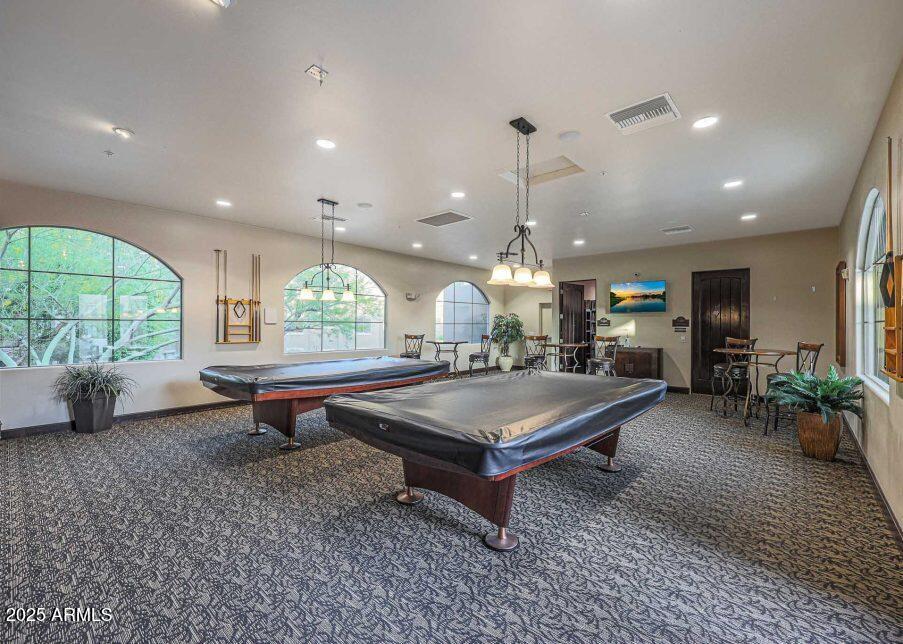 5450 East Deer Valley Drive, Unit 2191 Phoenix, AZ 85054 - Photo 35 of 50 a room with pool table table and sofas