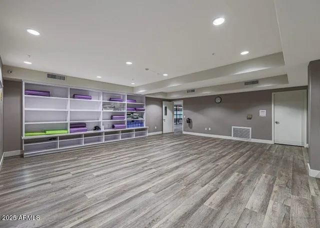 a view of a room with wooden floor and closet