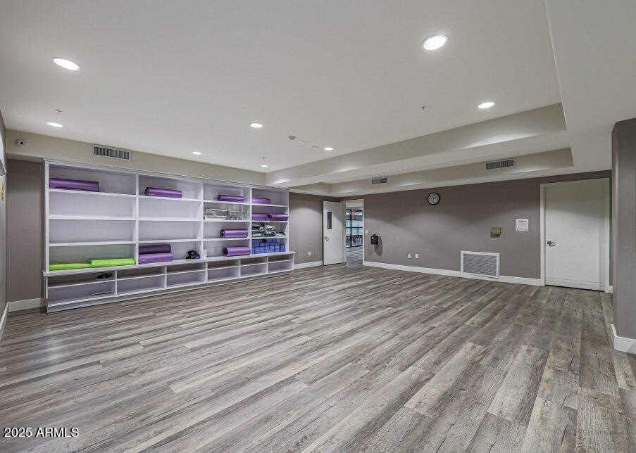 5450 East Deer Valley Drive, Unit 2191 Phoenix, AZ 85054 - Photo 40 of 50 a view of a room with wooden floor and closet