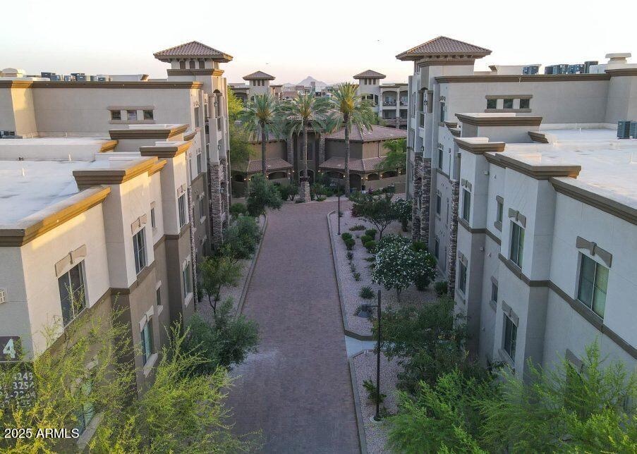 5450 East Deer Valley Drive, Unit 2191 Phoenix, AZ 85054 - Photo 43 of 50 a view of a house with a backyard and balcony