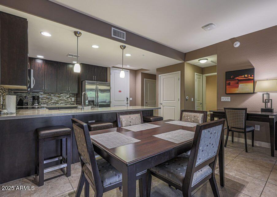 5450 East Deer Valley Drive, Unit 2191 Phoenix, AZ 85054 - Photo 9 of 50 a view of a dining area with furniture