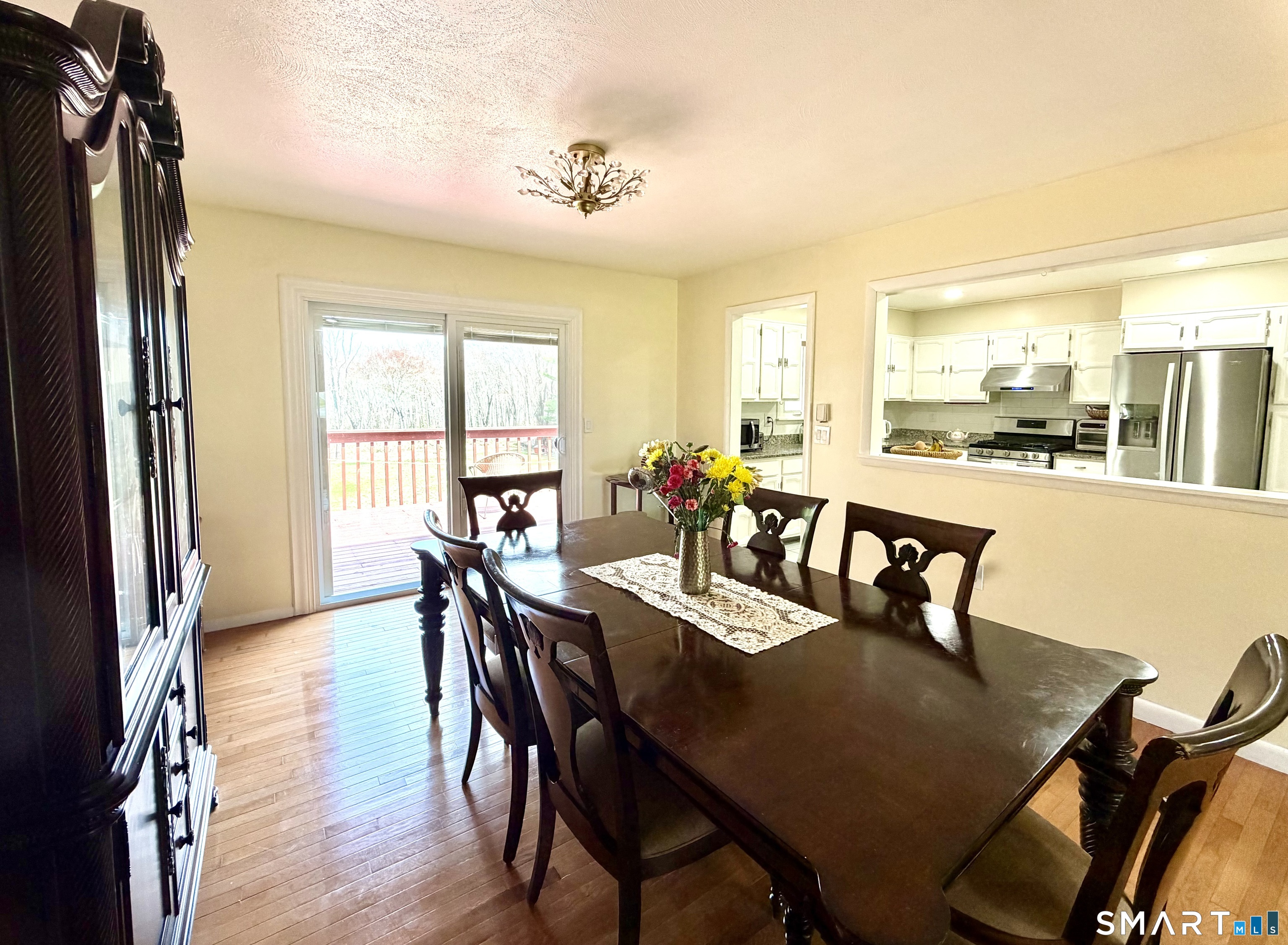 277 Windsorville Road Ellington, CT 06029 - Photo 13 of 40 a view of a dining room with furniture and a window