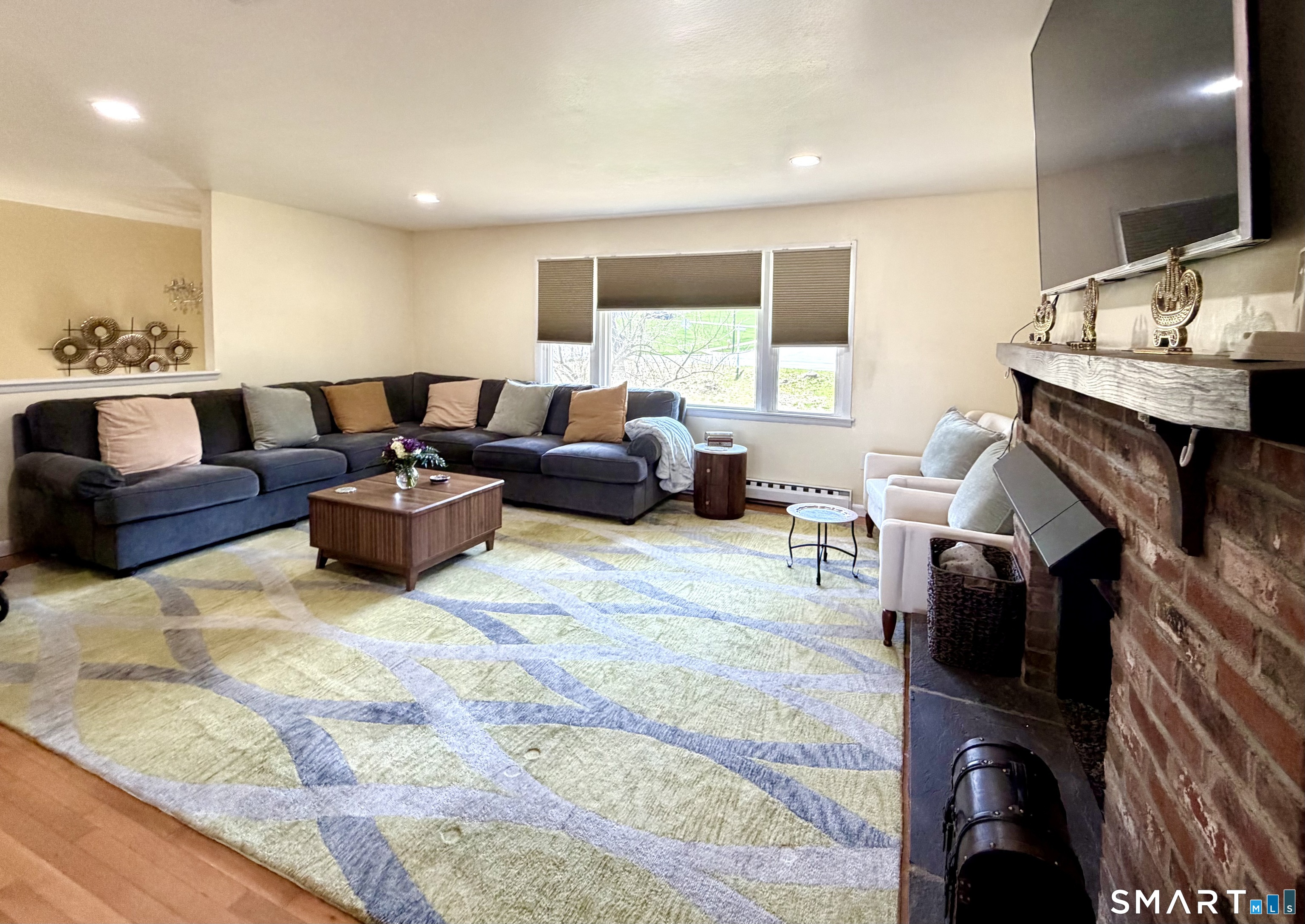 277 Windsorville Road Ellington, CT 06029 - Photo 14 of 40 a living room with furniture and a flat screen tv