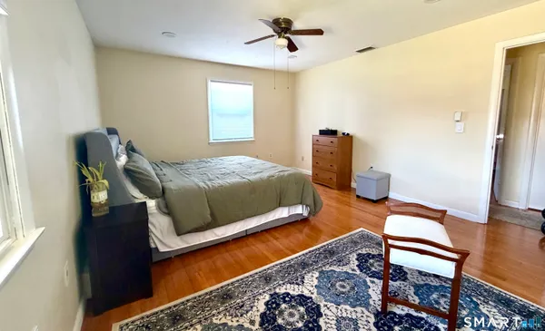 a bedroom with bed and window