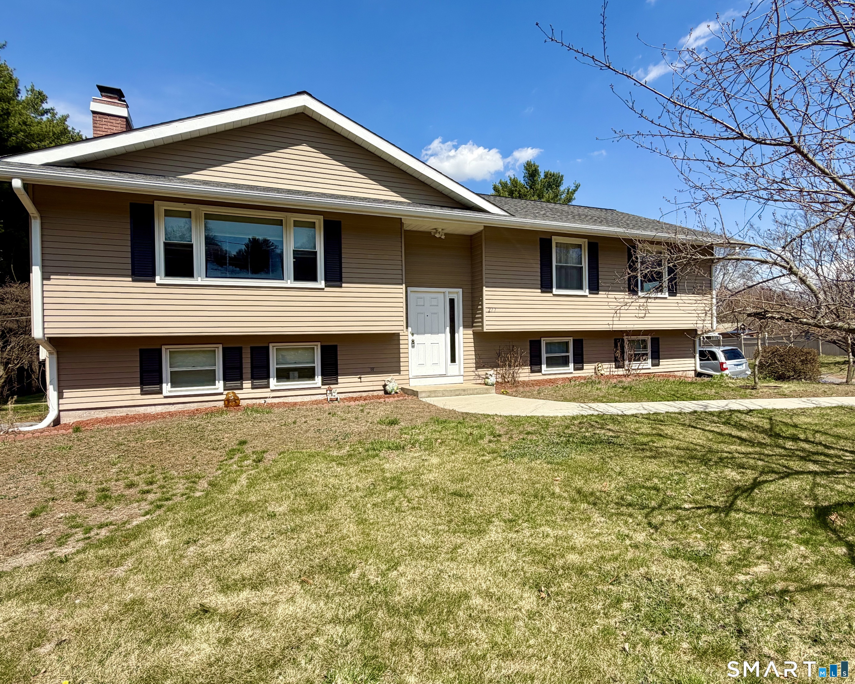 277 Windsorville Road Ellington, CT 06029 - Photo 2 of 40 a front view of a house with a yard