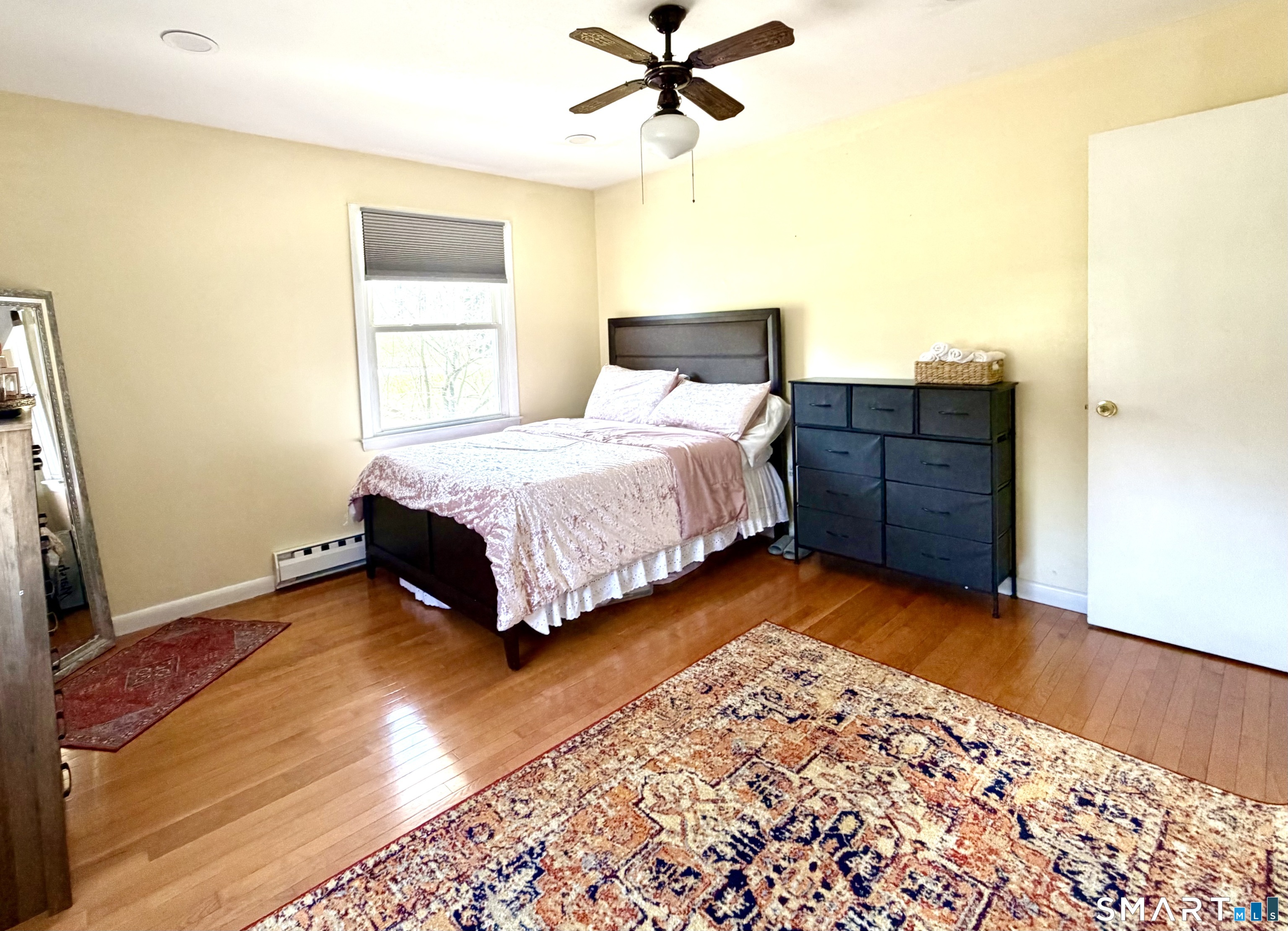 277 Windsorville Road Ellington, CT 06029 - Photo 21 of 40 a bedroom with a bed and a dresser