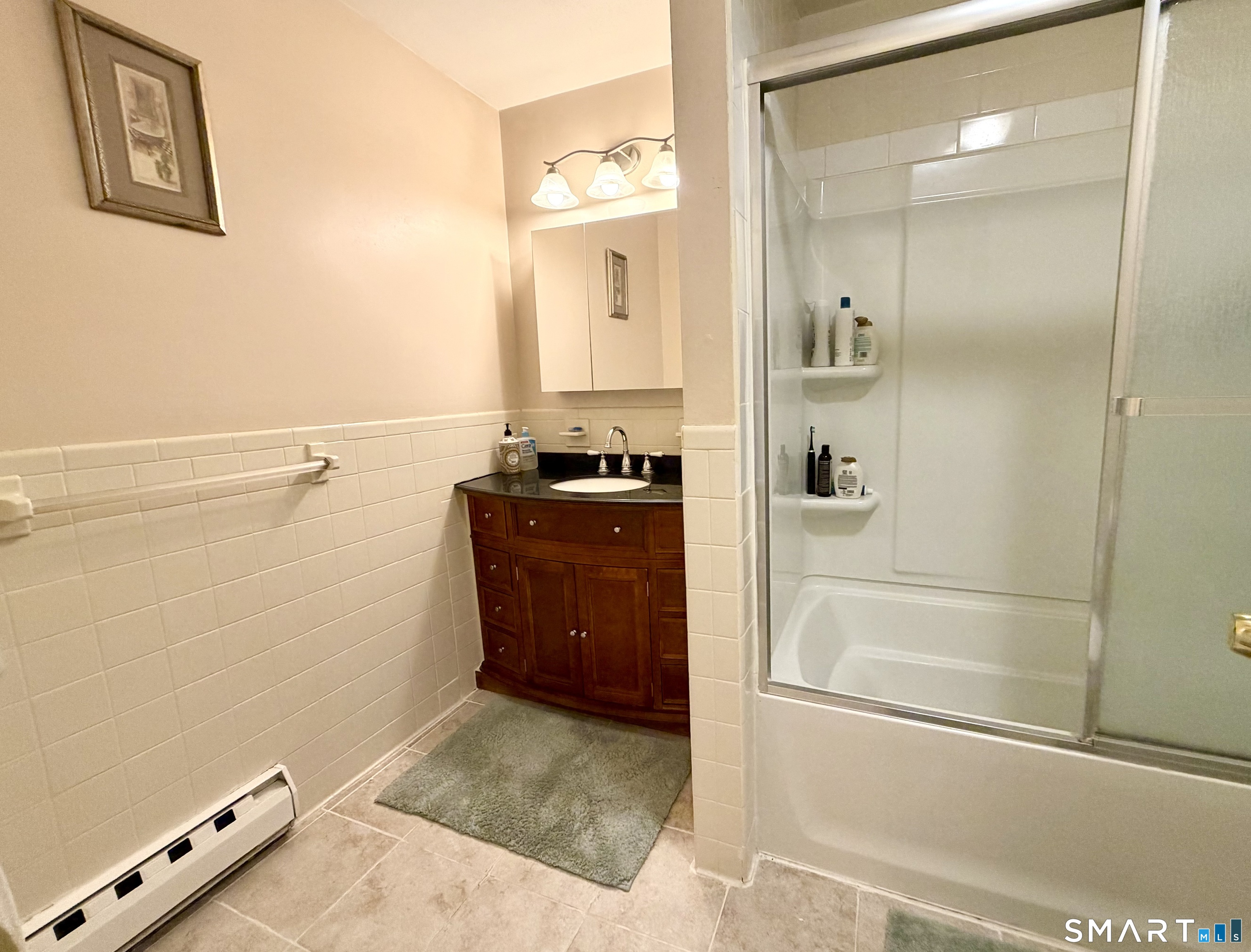 277 Windsorville Road Ellington, CT 06029 - Photo 24 of 40 a bathroom with a granite countertop sink mirror and shower