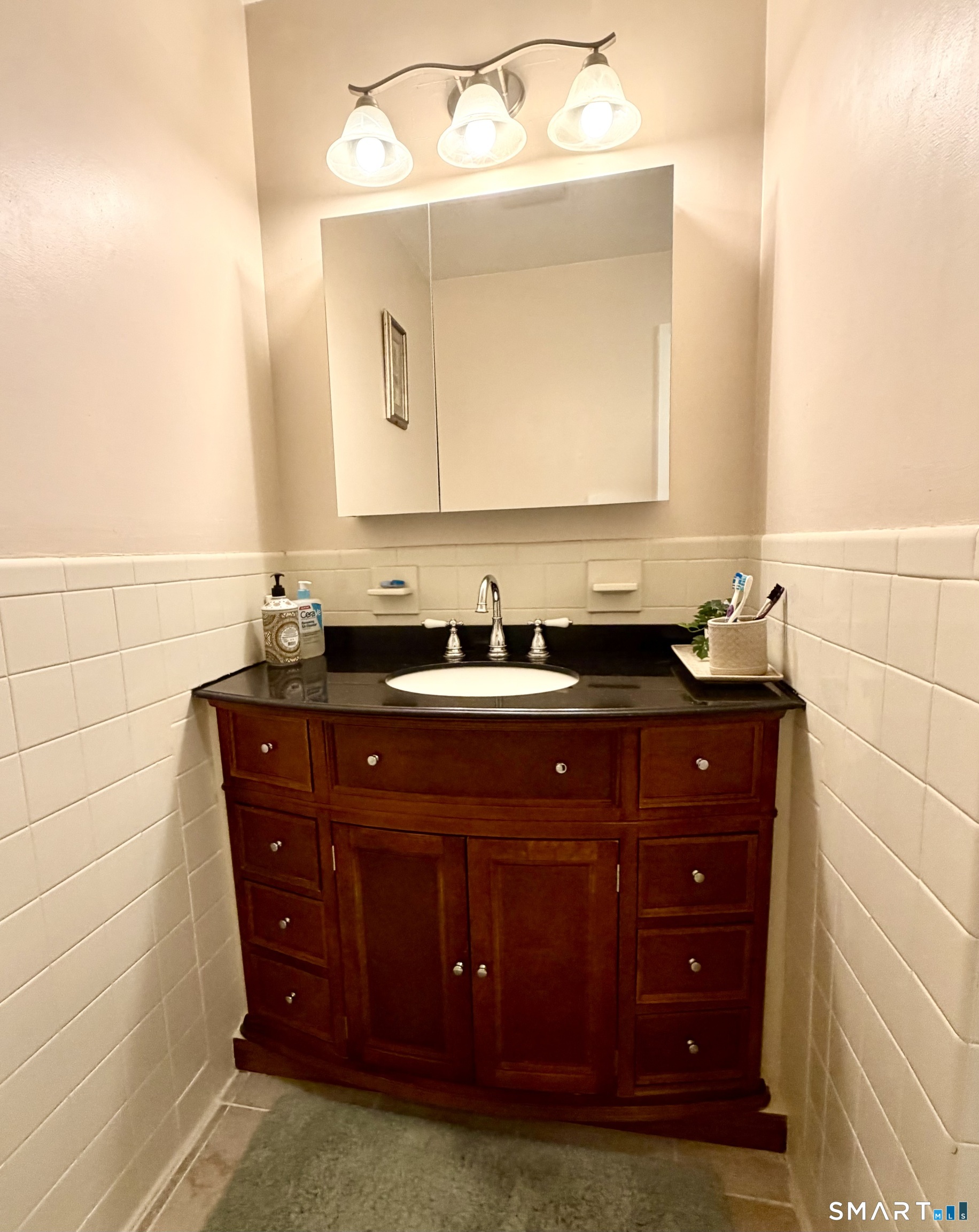 277 Windsorville Road Ellington, CT 06029 - Photo 25 of 40 a bathroom with a sink and a mirror
