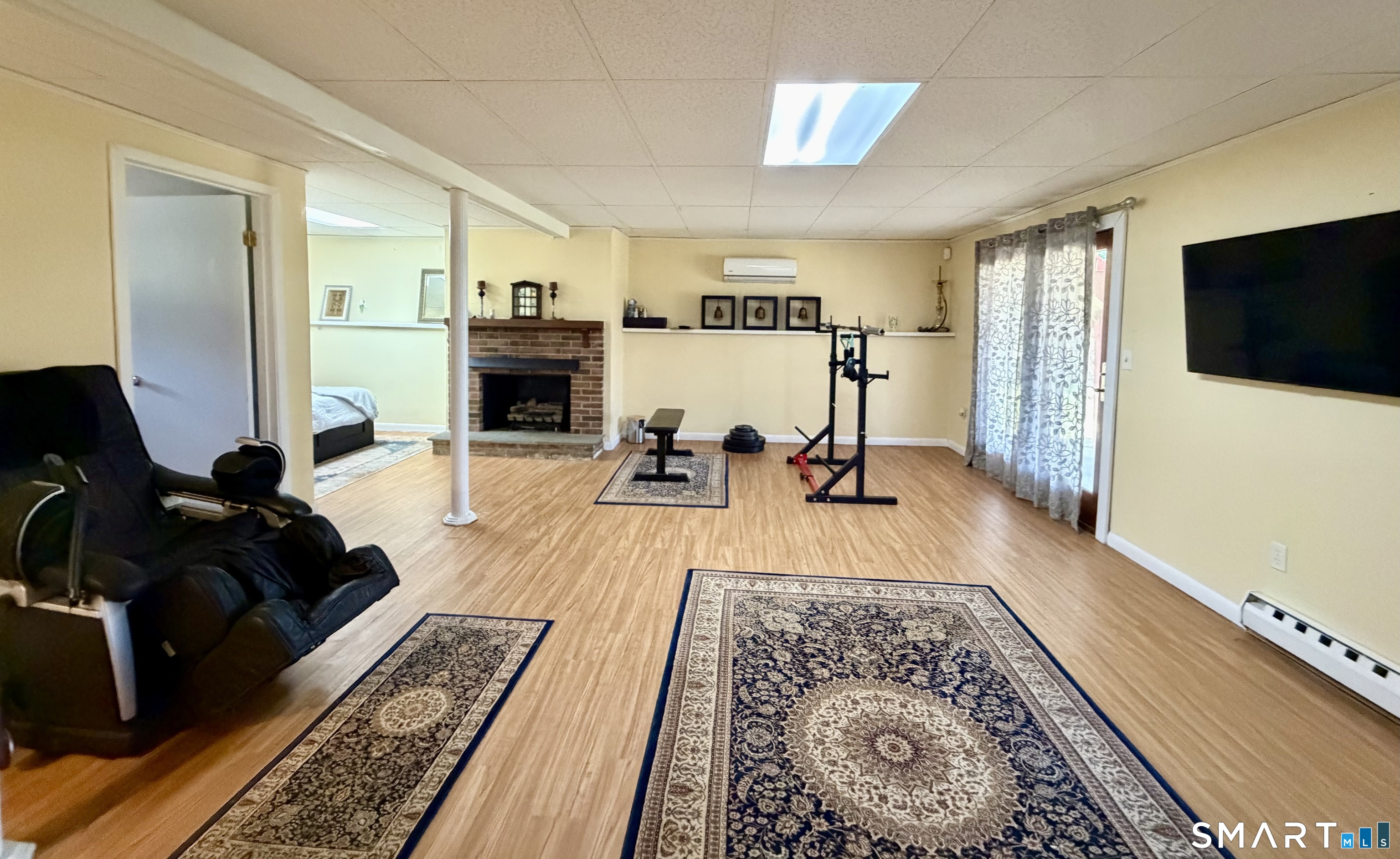 277 Windsorville Road Ellington, CT 06029 - Photo 27 of 40 a living room with furniture and a flat screen tv