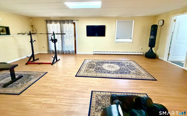 a view of living room with furniture and a rug