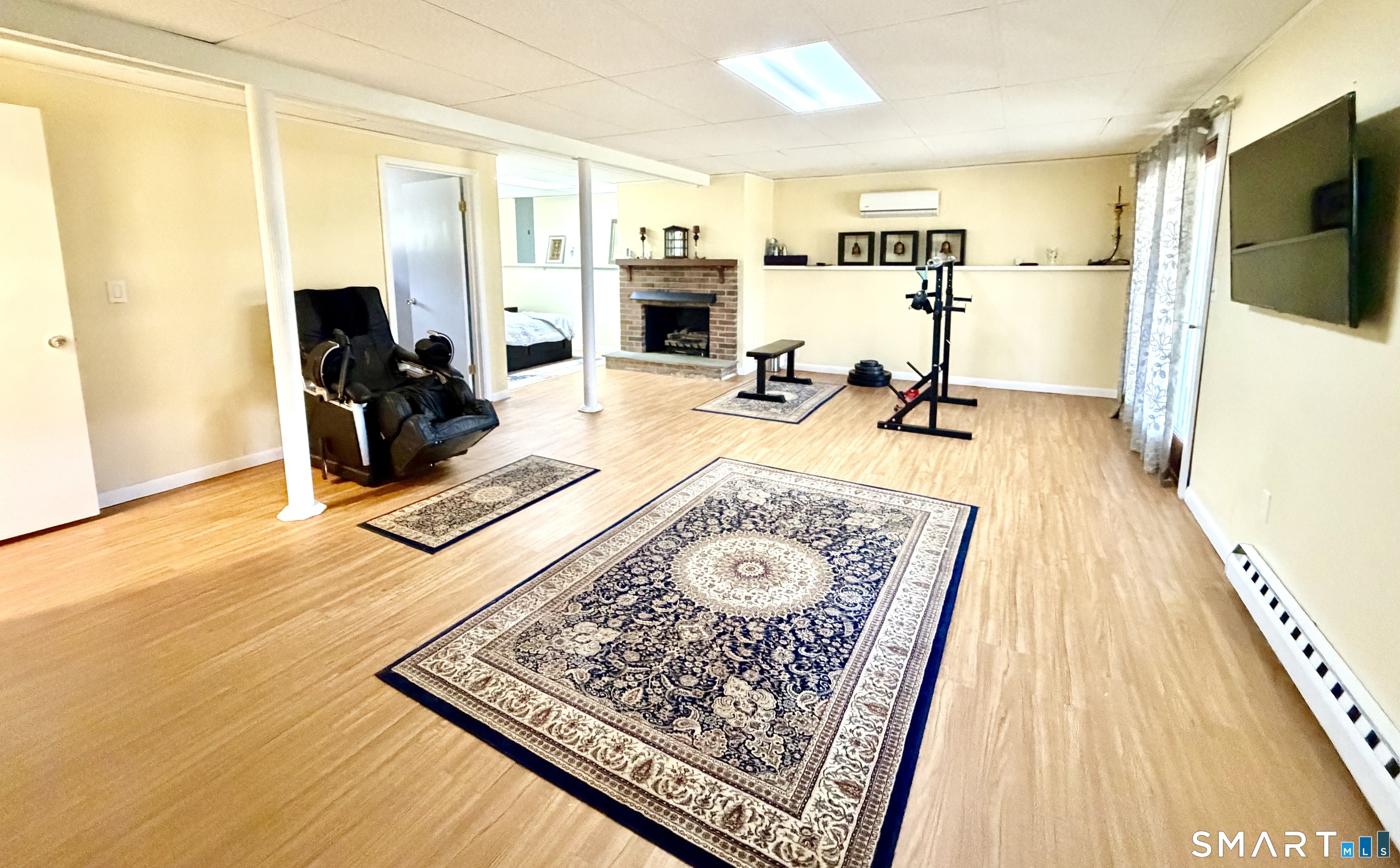 277 Windsorville Road Ellington, CT 06029 - Photo 30 of 40 a living room with furniture and a flat screen tv