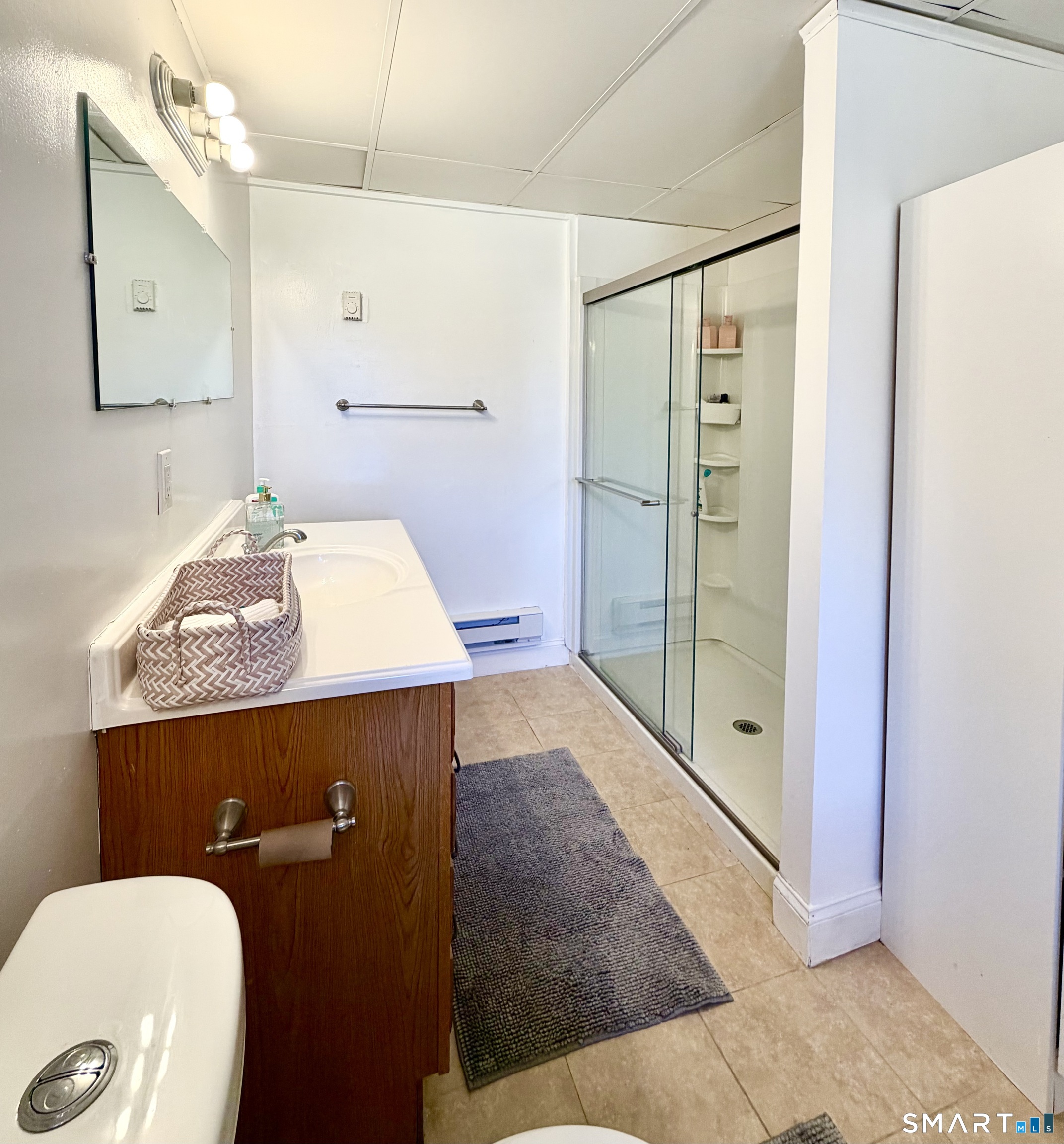 277 Windsorville Road Ellington, CT 06029 - Photo 31 of 40 a bathroom with a sink a toilet and shower