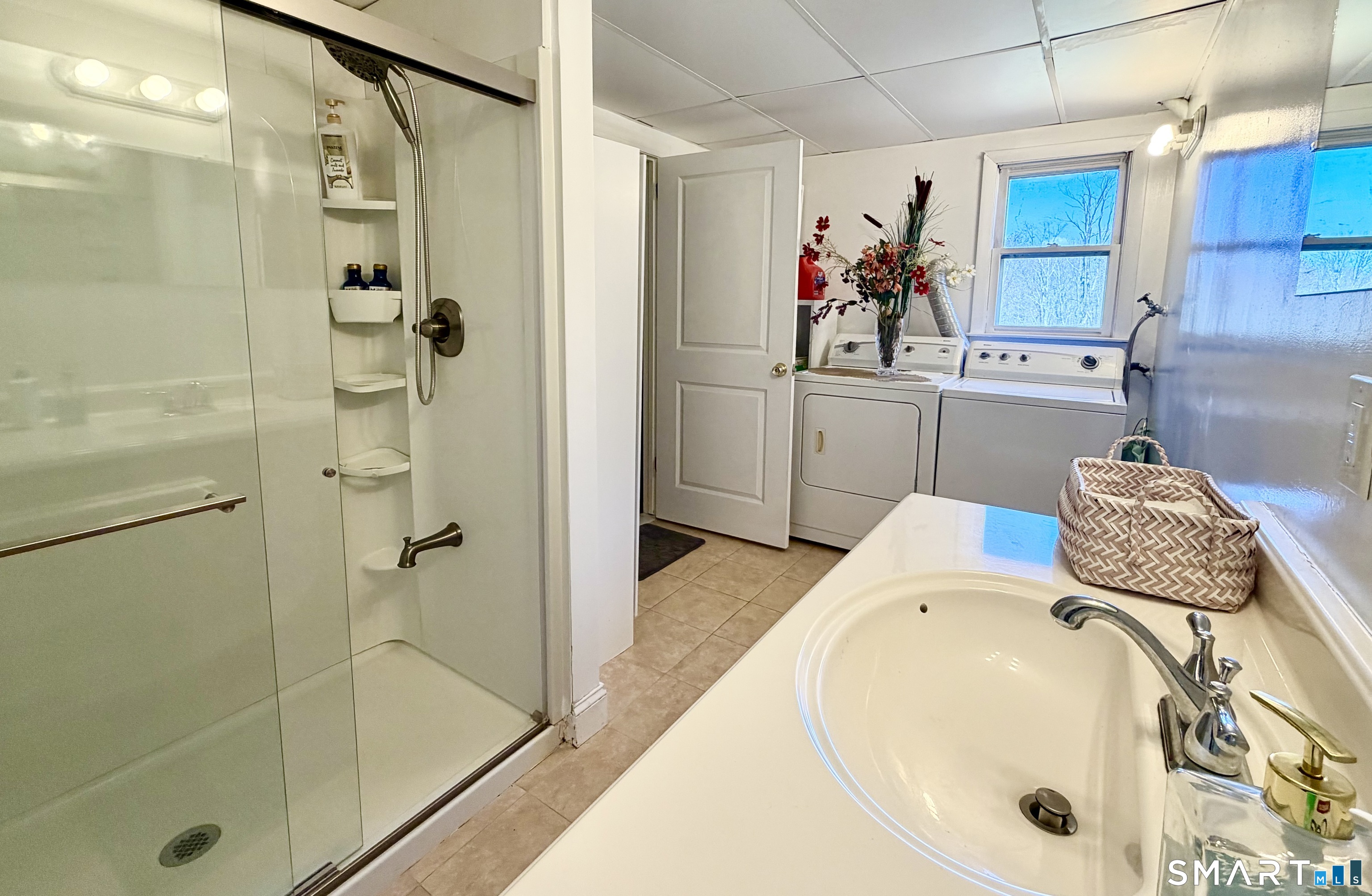 277 Windsorville Road Ellington, CT 06029 - Photo 32 of 40 a bathroom with a tub sink mirror and shower