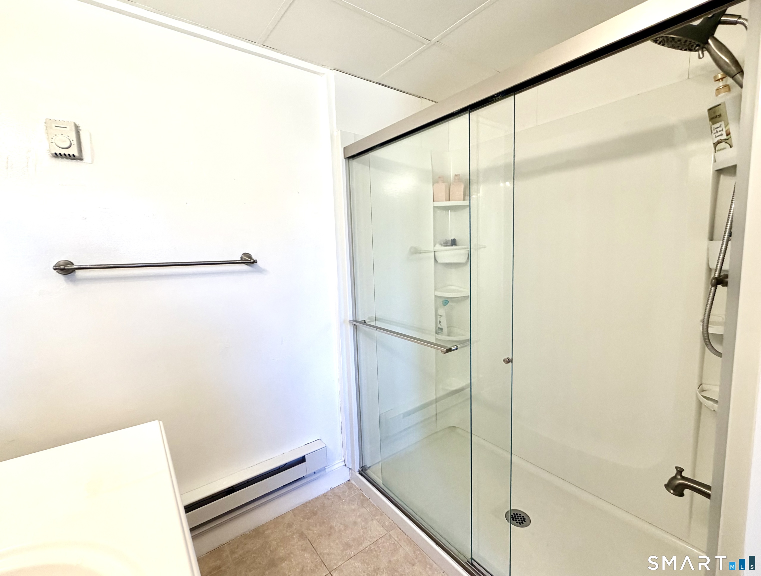 277 Windsorville Road Ellington, CT 06029 - Photo 33 of 40 a bathroom with a glass shower door