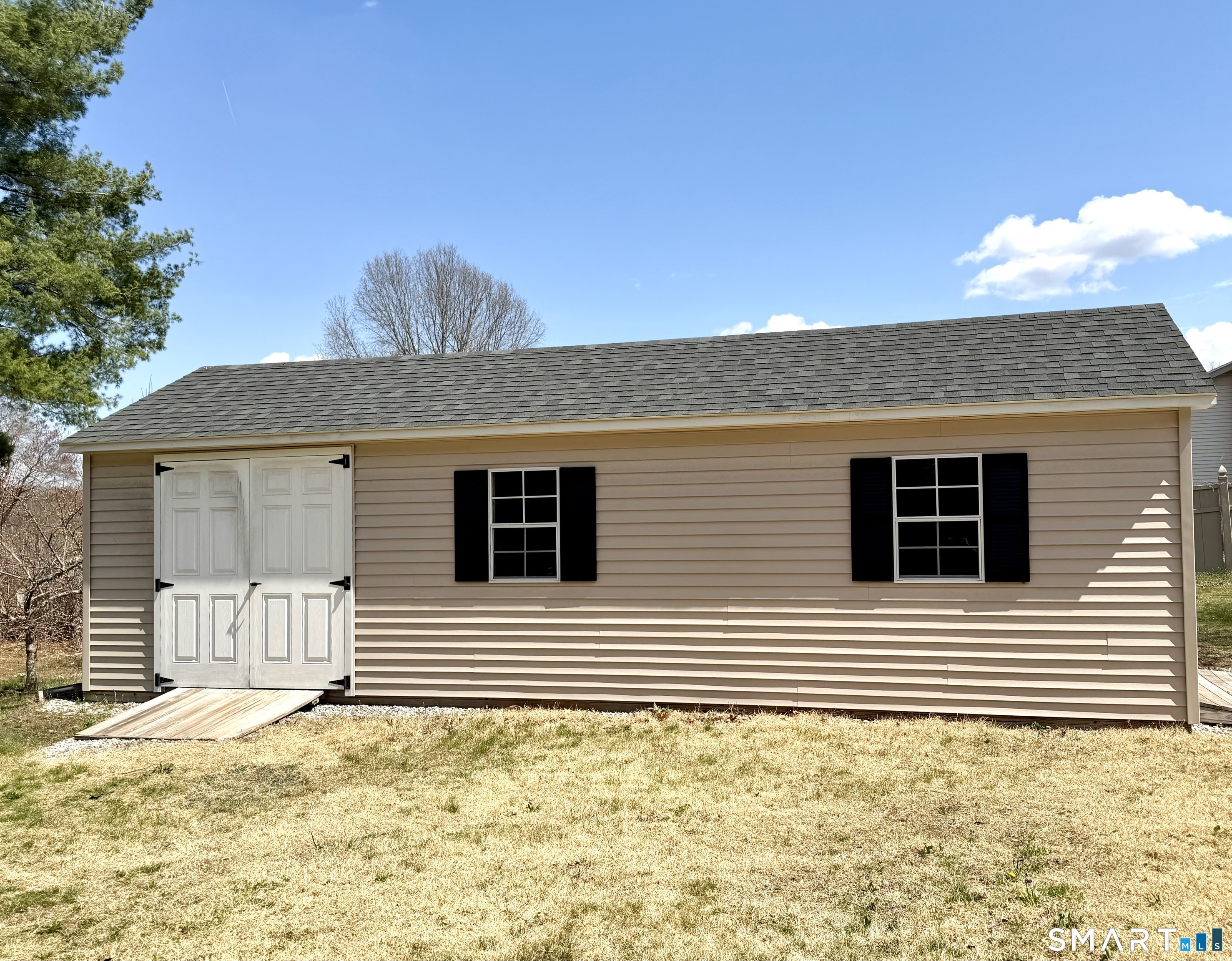 277 Windsorville Road Ellington, CT 06029 - Photo 37 of 40 a view of a house with a yard