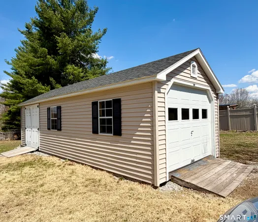 a view of a house with a house in the background