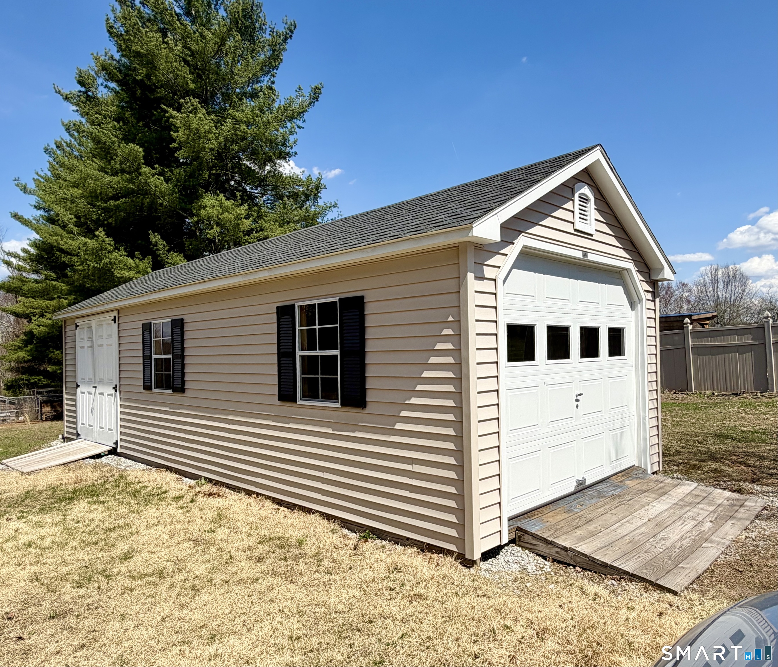 277 Windsorville Road Ellington, CT 06029 - Photo 38 of 40 a view of a house with a house in the background