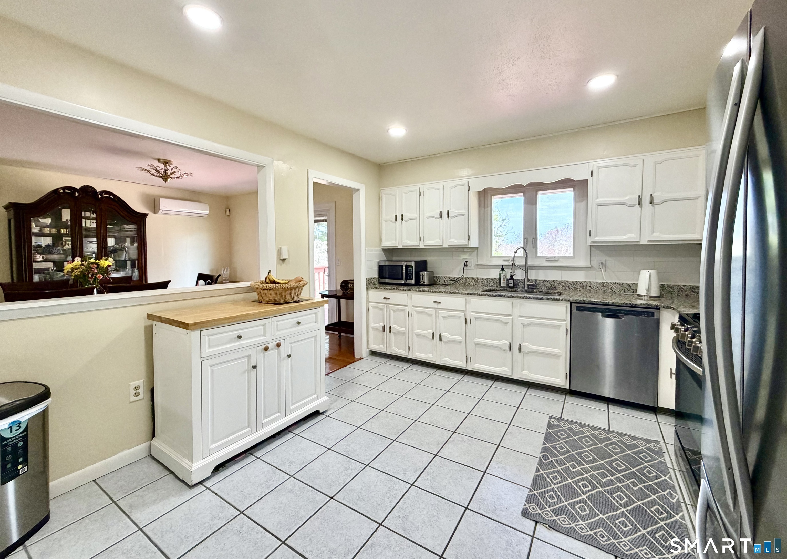 277 Windsorville Road Ellington, CT 06029 - Photo 9 of 40 a kitchen with a sink cabinets and window