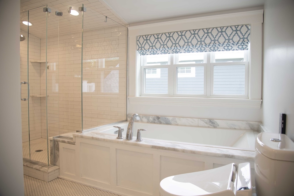 3 Chester Road, Unit 3 Belmont, MA 02478 - Photo 21 of 40 a white bath tub sitting next to a white toilet
