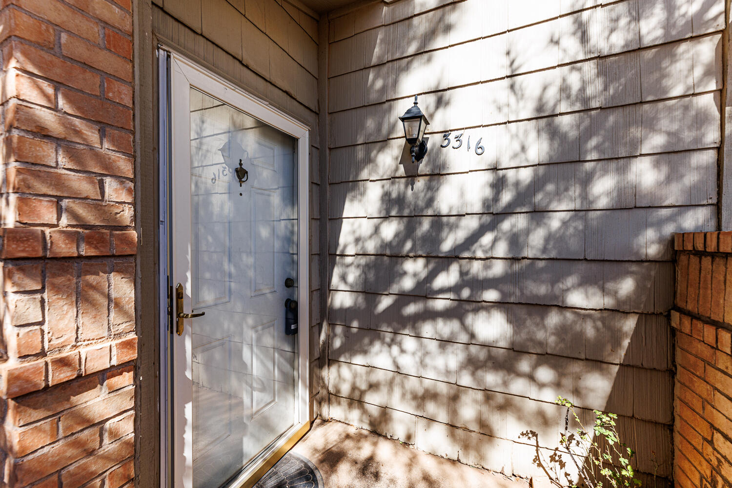 3316 79th Street Lubbock, TX 79423 - Photo 4 of 45 a bathroom with a glass shower door