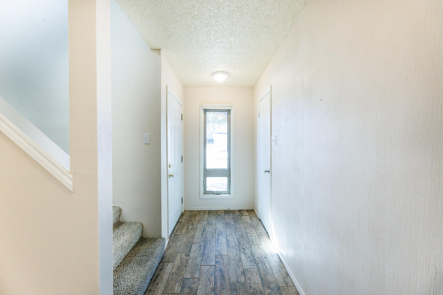 3316 79th Street Lubbock, TX 79423 - Photo 5 of 45 a view of a room with wooden floor and a window