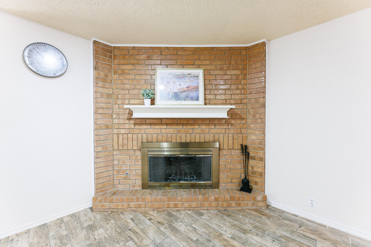 3316 79th Street Lubbock, TX 79423 - Photo 8 of 45 a view of an empty room with a fireplace